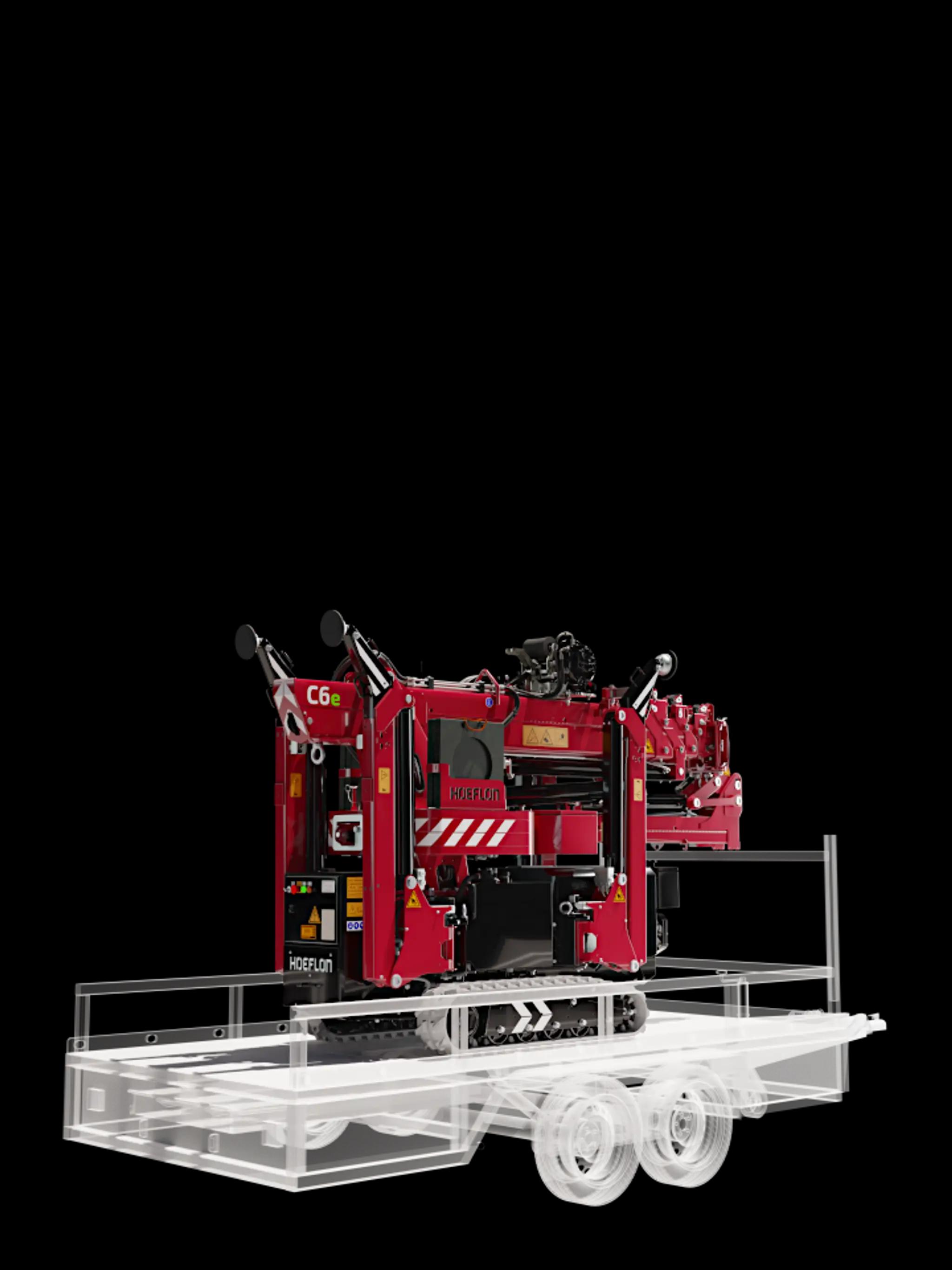 Hoeflon C6e in transportstand op compacte aanhanger.