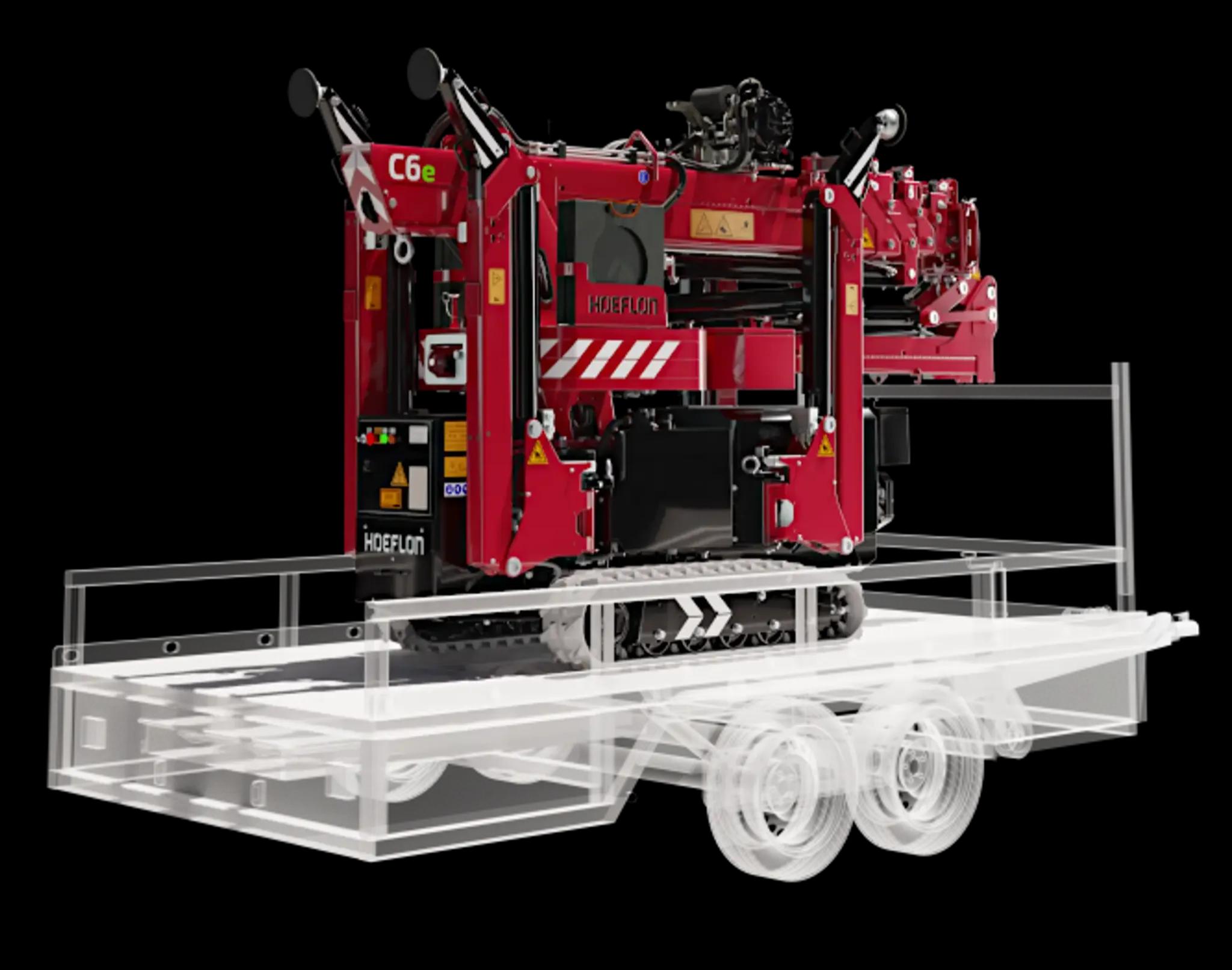 Hoeflon C6e in transportstand op compacte aanhanger.