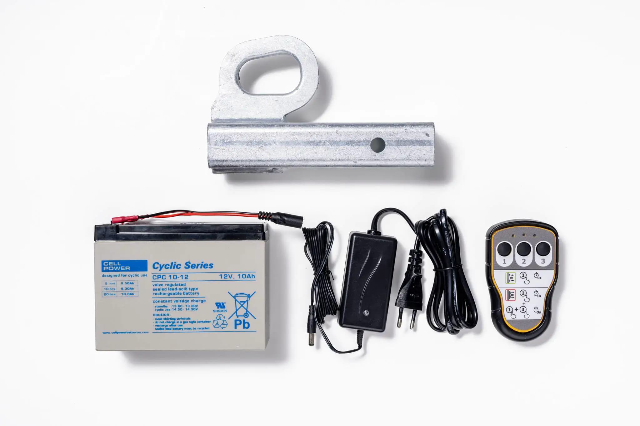 Accessoires voor Hoeflon C600: batterij, kabels, oplader en afstandsbediening.